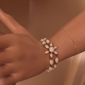 Milk white stones with gold tone chain bracelet.